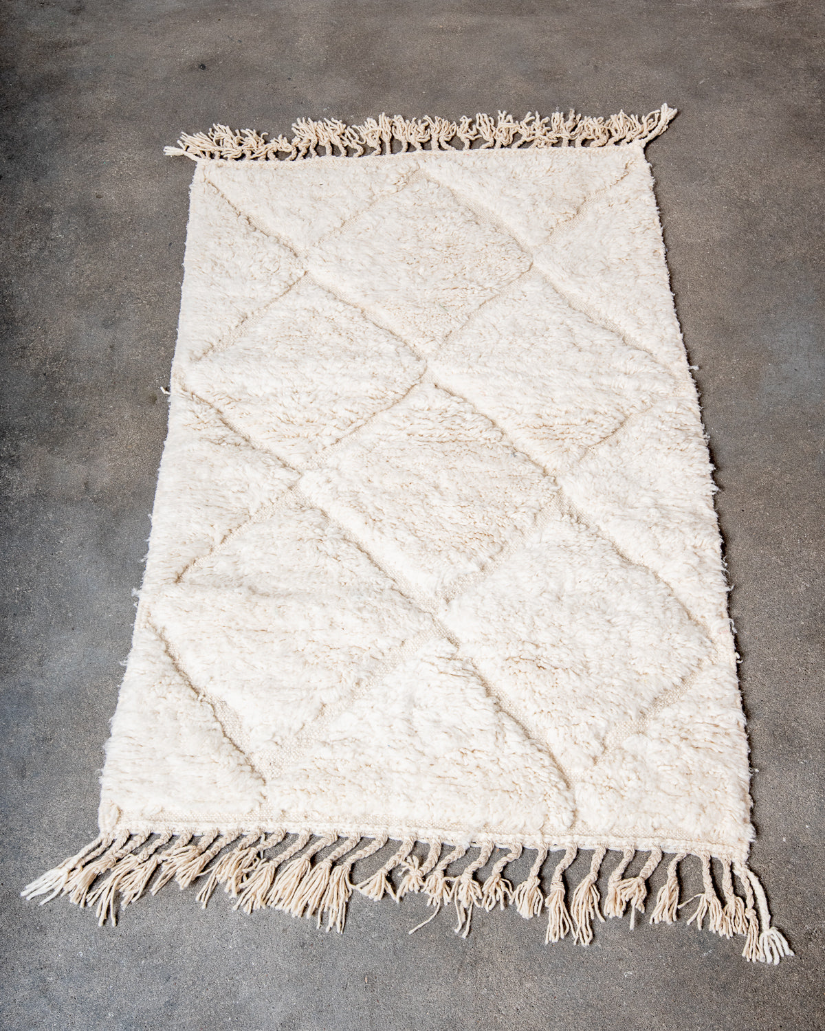 Modern, designer, handcrafted Berber rug from Morocco. Beniourain carpet with minimalist design, natural wool pile and a fluffy texture.